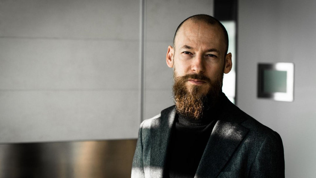 Bearded man with gray suit coat